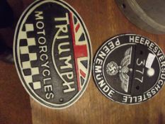 Triumph motorcycles plaque together with one other