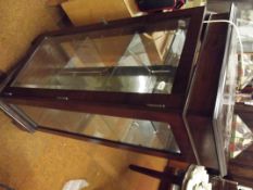 Illuminating mahogany display cabinet