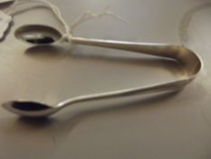 Set of silver sugar tongs
