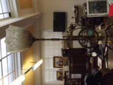 Brass lamp in the form of a spinning wheel