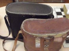 Two pair of cased binoculars
