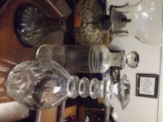 Two decanters and an oil lamp
