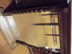 Wall mirror set in an oak barley twist frame