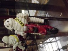 Cast iron Michelin man on motorbike