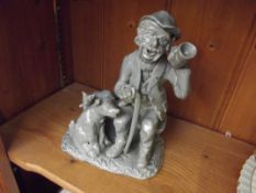 Heavy pottery figure man and a dog
