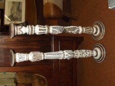 Matched pair of large wooden candle stands