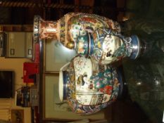 Two Satsuma vases together with a lidded Temple ja