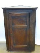 An Antique Oak Corner Cabinet, having three shaped internal shelves, approx 76 x 40 x 108 cms