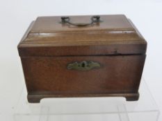 Two Stationery Boxes, one rosewood the other oak together with an Oak Tea Caddy.