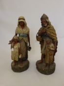 Two Antique Continental Plaster Figurines, one depicting a father and son, the child holding a
