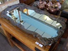 An Antique Wooden and Plaster Scallop Form Mirror, approx 97 x 99 cms.