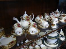 A Royal Albert 'Old Country Roses' Tea Set, comprising sixteen cups and saucers, two tier cake