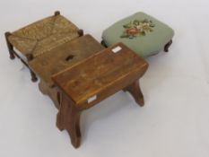 Two Foot Stools, one covered in tapestry, together with two vintage milking stools, one pine the