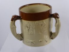 A Doulton Style Harvest Trig, with applied hunting scenes and greyhound handles, approx 15 cms,