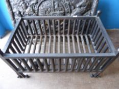 A Cast Iron Fire Grate Basket, on decorative wrought feet, approx 46 x 77 x 42 cms.