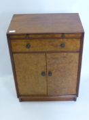 A Cornucopia Yacht Company Mahogany and Walnut Fronted Cabinet, the cabinet having single drawer