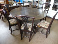 A Round Stained-Oak Antique Drop Leaf Dining Table, on pad feet approx 127 x 156 x 73 cms together