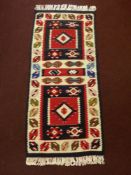 A 20th Century Turkish Tekke Woollen Kilim, multi coloured of geometric design, approx 113 x 50