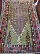 A 20th Century Turkish Kilim Woollen Rug of geometric design, with olive, blue, black and burgundy