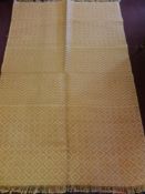 A 20th Century Tribal Weave Woollen Rug, geometric pattern, ochre and pink, approx 120 x 180 cms.