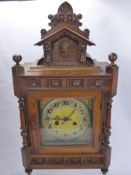 An Edwardian Continental Oak Case Mantle Clock, the clock having silvered and gold face and