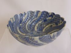 An Antique Quimper Cabinet Plate, depicting a stylised bird, monogram H.B., together with a F.J.B.