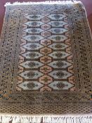 A Fine Woollen Persian Rug, with floral and bird design in pink, green and pink tulip design on blue