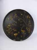 A Japanese Meiji Period Iron Charger, with mixed metal work in gold and silver, depicting a crane
