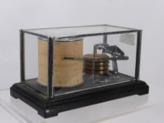 A Small German Barograph, under glass.