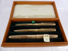 A 9 Ct Gold Vintage Flamme Parker Pen Set, comprising ink pen, biro pen and pencil in the original