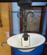 An Art Nouveau Ceiling Light Fitting, with wrought iron fitting and glass shade.