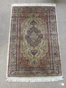 A Contemporary Turkish Style Woollen Carpet, geometric design of peach, blue and celadon green,