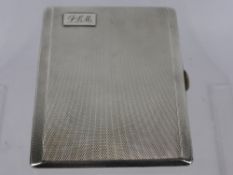 A Solid Silver Engine Turned Cigarette Case, the case having gilded interior and engraved 