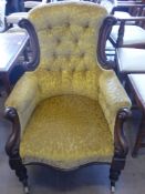 A Victorian Mahogany Arm Chair, with decorative carving to chair back and sides, on turned legs with