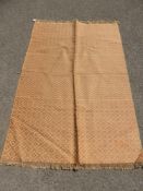 A 20th Century Tribal Weave Woollen Rug, geometric pattern, ochre and pink, approx 120 x 180 cms.