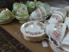 A Colclough Bone China Tea Set, comprising tea pot, milk jug, two sugar bowls, seven cups, ten