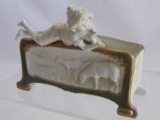 A Continental Jardiniere, depicting a shepherd boy playing a flute.