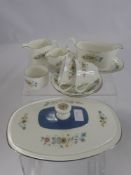 A Royal Doulton 'Pastoral' Service, comprising nine cups, ten saucers, two milk jugs, one creamer,