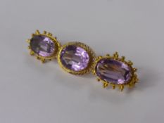 An Antique 15 ct Yellow Gold Amethyst Brooch, 1 x 12 x 9 mm, 2 x 13 x 8.5 mm amethyst, approx 5.1