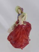 A Royal Doulton Figurine, entitled 'Autumn Breeze', approx 20 cms.