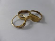 A 9 ct Gold Gentleman's Signet Ring, size T together with a wedding band size U, a 9 ct gold