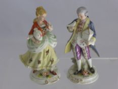 A Pair of Continental Figurines, depicting flower sellers approx 14 cms high, together with a pair