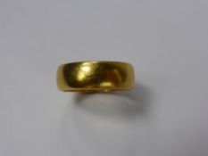 A Gentleman's 22 ct Gold Wedding Band, London hallmark, mm rubbed, dated 1971, size M, approx 6.8