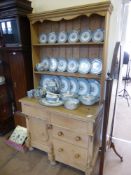 An Antique Pine Farmhouse Dresser, two cutlery drawers with cupboards beneath, two further short