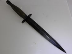 A Fairbairn-Sykes Third Pattern Fighting Knife, the knife with blued 7
