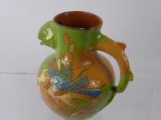 A Charles Brannam 'Barum' Motto Ware Grotesque Fish Head Jug, incised with swimming fish, bearing