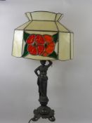 A Bedside Lamp, the base depicting a woman in the classical style, the shade of floral design,