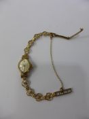 A Lady's 9ct Gold Accurist Cocktail Watch, mounted on a 9ct Gold Bracelet, approx 10.3 gms