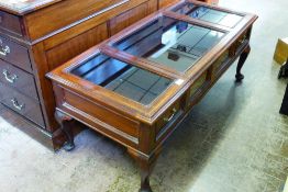 A Rosewood Glass Topped Coffee Table, with two drawers, raised on pad feet, approx 123 x 56 x 50.