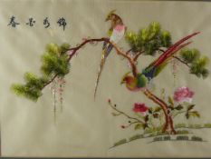 Two Chinese Embroideries on Silk, depicting an oriental pheasant seated on a tree branch, the